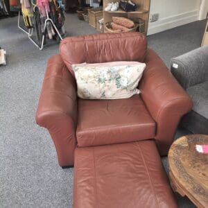 Red leather armchair with footstool
