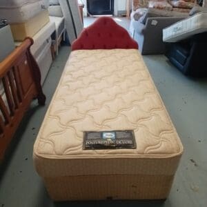 Single bed with pink headboard