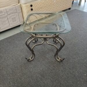 Small glass top side table with ornate metal base