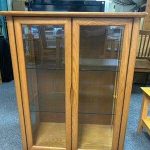 Wooden display cabinet with glass doors