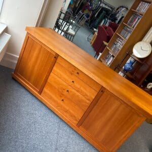 Large wooden cabinet with drawers and doors