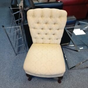 Cream fabric button-back accent chair