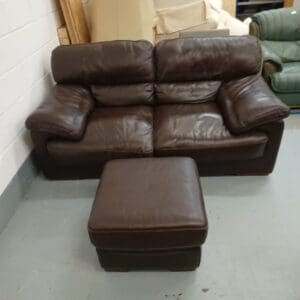 Brown leather two seater sofa with footstool