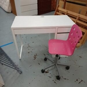 White office desk with pink swivel chair